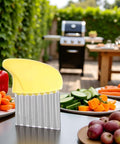 Crinkle cutter with yellow plastic guard on stainless steel ribbed body for vegetables