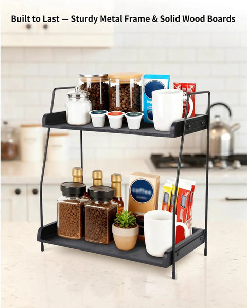 Two Tier Coffee Bar Organizer For Countertop With Metal Frame And Wooden Shelves All In One Coffee Station Rack showcasing pods, syrups, and cups.