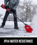 Badass Brushless 40 Volt Cordless Snow Shovel Kit With A Meaty 12 Inch Deck Using for snow cleaning in a winter driveway.