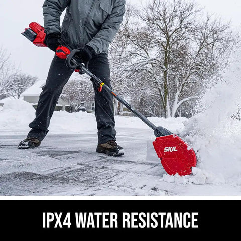 Badass Brushless 40 Volt Cordless Snow Shovel Kit With A Meaty 12 Inch Deck Using for snow cleaning in a winter driveway.
