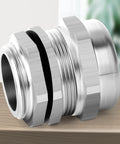 Two Pack Stainless Steel Waterproof Cable Gland With Nut For NPT Half Inch Threads Adjustable 8 To 12mm Cable Gland Protectors on tabletop