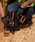 Worker using sturdy leather tool pouch with eleven pockets for belt up to two and three quarters inches moisture resistant