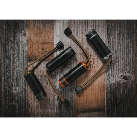 Rip Spool Field Repair Kit Orange For On The Go Fixes on wooden surface with black and orange durable cases