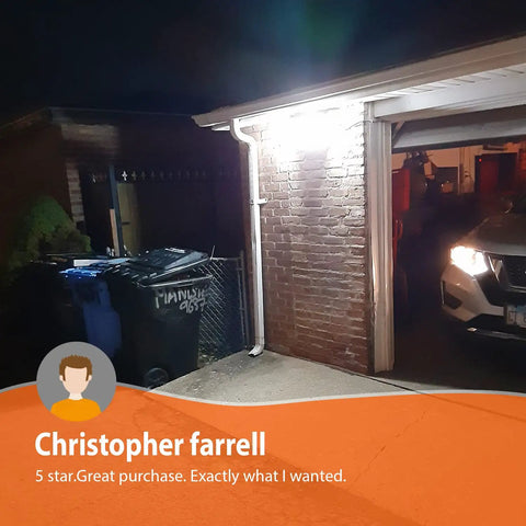 Ultra Bright Outdoor Security Flood Light With Motion Sensor 1500 Lumens illuminating garage exterior at night