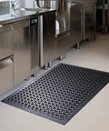 Anti Fatigue Outdoor Rubber Floor Mats 2 Pack For Commercial Kitchens And Restaurants Grippy Non Slip Drainage Mats For Indoor Outdoor Use Bar Garage 36x60 Inches Black in a stainless steel kitchen setting.