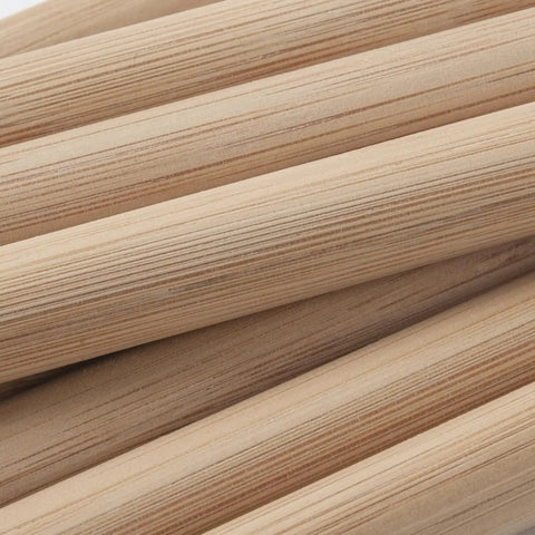 Premium Smooth Bamboo Wood Dowel Rods For Crafting, 1/2 X 15 Inch unfinished sticks stacked showing smooth surface and grain.