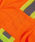 Close-up of Heavy Duty Neon Orange Mesh Safety Vest With Seven Pockets And 3M Reflective Tape showing breathable mesh material.