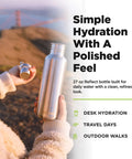 27 Oz Brushed Stainless Steel Water Bottle With Bamboo Lid Leak Proof Reusable Drinkware held outdoors for hydration.