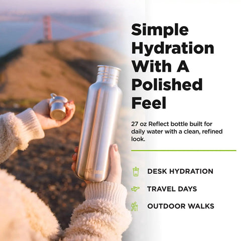 27 Oz Brushed Stainless Steel Water Bottle With Bamboo Lid Leak Proof Reusable Drinkware held outdoors for hydration.