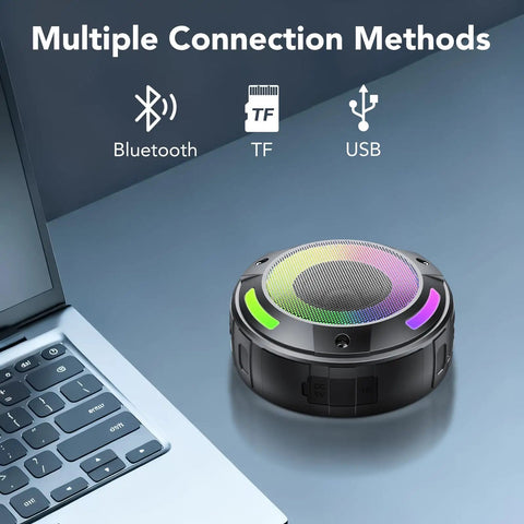 Dope Portable Wireless Shower Speaker With Digital Display And Detachable Hook IPX7 Waterproof LED Light shown next to a laptop