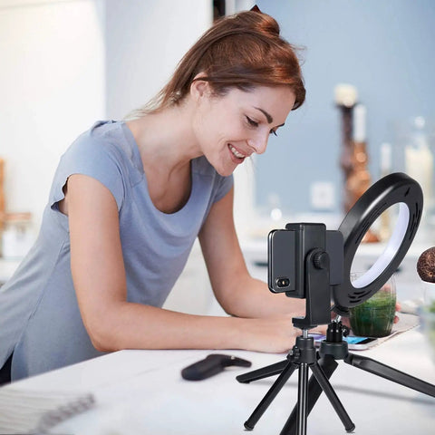 Woman using 6 Inch Ring Light With Tripod Stand For Desk Use Perfect For YouTube Vids, Makeup Tutorials And Selfies in kitchen