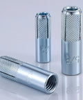 Premium Zinc Plated Drop In Anchors For Solid Concrete 5 16 Inch 18 Thread Knurled Steel Expansion Screws 20 Piece Heavy Duty Kit close-up view of several zinc plated anchors with knurled design.
