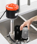 No Sweat Electric Commercial Glass Washer Cranks Out Eight Hundred Cups Per Hour, brushes cleaning a glass in sink.