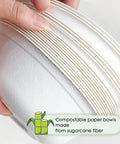 Hand holding stack of Heavy Duty 12 Oz Disposable Paper Bowls, 150 Pack, Biodegradable Compostable Sugarcane Bagasse