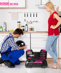 Pink 40 Piece Hand Tool Kit Set with Storage Toolbox for DIY home use, including tools, open on a kitchen floor next to washer repair scene