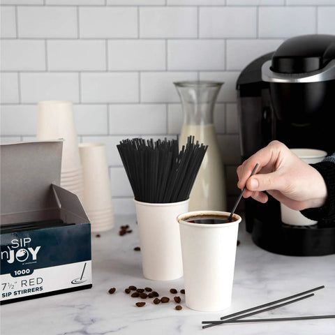 Skinny Black Plastic Sip Stirrer Straws For Coffee And Cocktails, Seven And A Half Inch Stirrers in coffee next to box