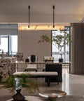 Artpad 47.24-Inch Modern Long Marble Dining Pendant Light, Suspension Lamp over marble dining table in stylish interior.