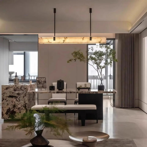 Artpad 47.24-Inch Modern Long Marble Dining Pendant Light, Suspension Lamp over marble dining table in stylish interior.
