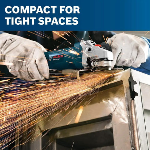 Hands using powerful 7.5 Amp 11000 RPM four and one half inch angle grinder on metal, creating sparks in tight space