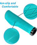 Close-up of turquoise ergonomic mountain bike grips with palm pad and non-slip lock-on design for all day comfort and pain relief.
