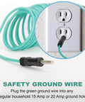 Green safety ground wire plugged into a household outlet, illustrating the ETL listed Dryer Adapter From 4 Prong To 3 Prong For Old School Homes Converts NEMA 10-30P Plug To 14-30R Receptacle 10 AWG STW 1.5 Foot Cord With Ground Wire.