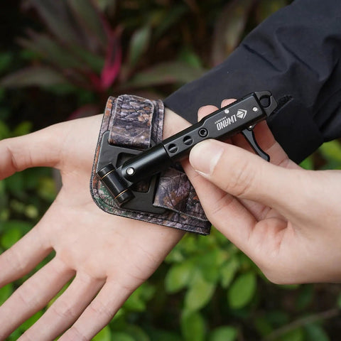 Archery Release Aid For Compound Bows With 360 Degree Rotating Trigger Wristband in use, showing adjustable camouflage design.
