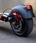 Zoom HB-100 hydraulic disc brake caliper set, red caliper with silver rotor mounted on a black wheel