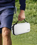 Person carrying Hard Shell Golf Glove Case With Removable Glove Shaper Protective Organizer For Balls Tees And Markers