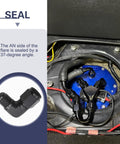 Two black aluminum 6AN female to 3/8 barb 90-degree hose fittings; automotive fuel system installed near blue regulator