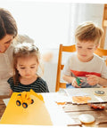 Children playing with 4 Piece Front End Loader Plastic Engineering Vehicle Models for Compact Construction Trucks indoors