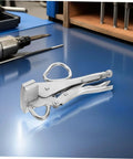 Adjustable Auto Body Sheet Metal Clamp Pliers with Beefy Wide Flat Duckbill Jaws for precise welding, on a workshop table.