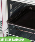 Pink Mini Oven With Healthy Ceramic Nonstick Coating, interior view with aluminized stainless steel rack and chrome pan handle