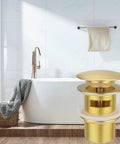 Slick Brass Freestanding Tub Drain Featuring Smooth Pop Up Plug Brushed Gold Hardware Fits Almost Every Standalone Tub Kit highlighted in bathroom setting.