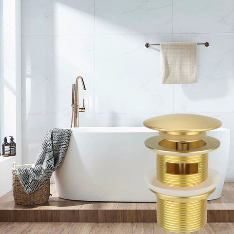Slick Brass Freestanding Tub Drain Featuring Smooth Pop Up Plug Brushed Gold Hardware Fits Almost Every Standalone Tub Kit highlighted in bathroom setting.