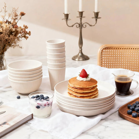 36 Piece Reusable Wheat Straw Dinnerware Set For Six With Plates, Bowls, and Cups displayed with pancakes on a marble table