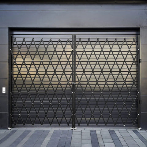 Heavy Duty Double Folding Security Gate Eighty Seven Inches Tall By One Hundred Fifty Inches Wide Built Like A Tank With Fourteen Gauge Steel And Black Powder Coat For Serious Perimeter Lock Down, showcasing the gate's closed configuration.