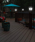 Outdoor Solar Powered Post Cap Lights For 4x4 Wood Posts illuminating a deck with seating area, showing classic lantern style in use.