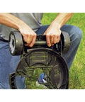 Person attaching removable deck to 12-inch trimmer, converting it into a mower, showcasing two height settings on grass field