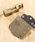 Antique Bronze Cabinet Hinges With Lock Latch Hasp 2 Pack for Wooden Boxes and Cupboards, shown on a wooden surface