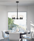 Dining room with Five Light Indoor Chandelier in Matte Black Finish With Clear Glass Cool Modern Vibe, sloped ceiling ready