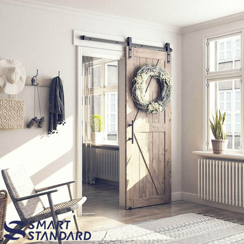 Heavy Duty 5ft Sliding Barn Door Hardware Kit With Track Kit, Pull Handle Set, And Floor Guide, installed on door