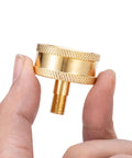 Close-up of Beast RV Brass Blow Out Plug Adapter with 3/4 Inch GHT Female And Male Garden Hose Quick Connect held in hand