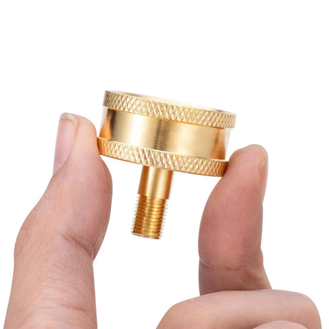 Close-up of Beast RV Brass Blow Out Plug Adapter with 3/4 Inch GHT Female And Male Garden Hose Quick Connect held in hand