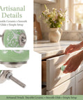 Top Shelf Vintage Floral Ceramic Cabinet Knobs And Drawer Pulls Set To Freshen Your Space With A Darn Cute 40mm Round Design close-up of green floral knob with smooth glide.