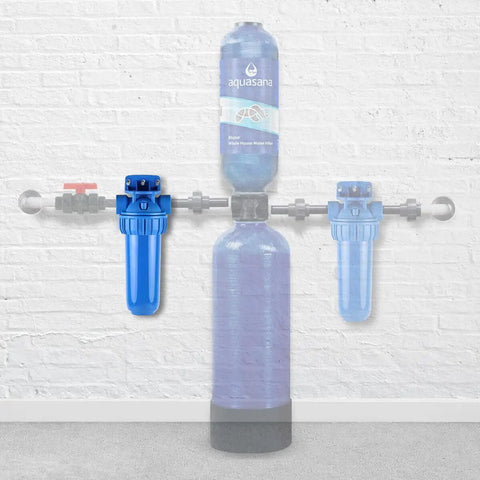 Whole House 10-Inch Sediment Pre-Filter Replacement Pack, 4 Count, attached to home filtration system against white wall.