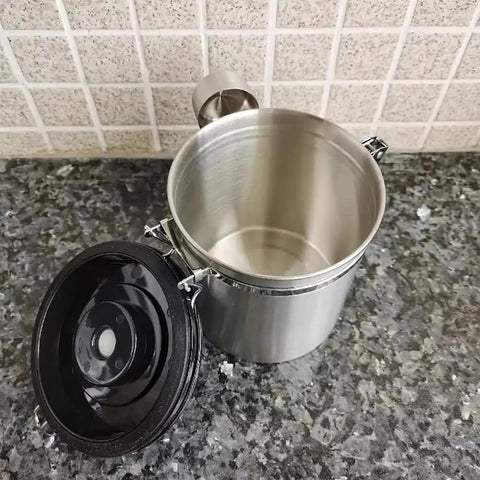 Rock Solid 304 Stainless Steel Coffee Canister Featuring One Way Degassing Valve And Rotatable Date Tracker Keeps Your Daily Grind Fresh And Legit Snap Tight Airtight Tea Storage Container, interior view with black lid open.