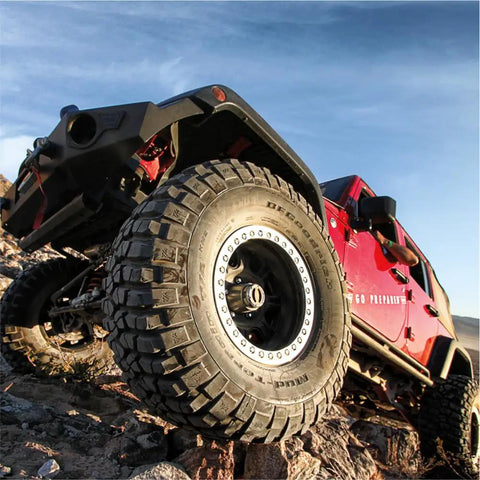Close-up of SUV tire with Premium Manual Locking Hub Kit With 19 Spline Fit Zinc Aluminum Dial Dual Seals Chrome Finish