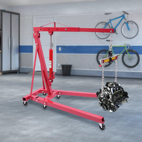 Heavy Duty Folding Hydraulic Engine Hoist And Crane, 2 Ton Capacity With Portable Wheels, Includes Engine Leveler Bar in garage setting.