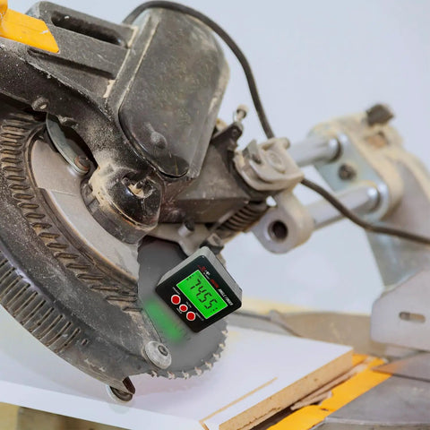 Digital Angle Finder Magnetic With Case And Backlit LCD For Table Saw Woodworking And Construction IP54 Rating Precision To 0.2 Degree Absolute And Relative Modes Zero Reset And Easy Read shown measuring saw blade angle.