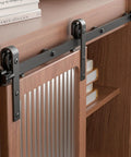 Compact 2.5 Foot Mini Sliding Barn Door Hardware Track Kit installed on small cabinet, black steel rail with J shape hangers